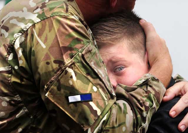 Regional Finalist – Anthony Chappel-Ross. CO Vaudin of 2 signal Regiment embraces his son Nicholas, 12, on his return. (Photo by Anthony Chappel-Ross/The Press, York)