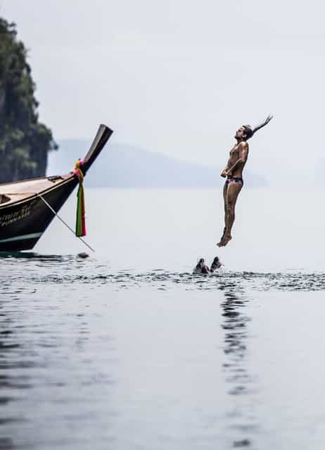 In this handout image provided by Red Bull, Orlando Duque of Colombia prepares for his water entry after diving from the 27 metre platform at training on Hong Island in the Andaman Sea during the final stop of the 2013 Red Bull Cliff Diving World Series on October 25, 2013 at Krabi, Thailand. (Photo by Dean Treml/Red Bull via Getty Images)