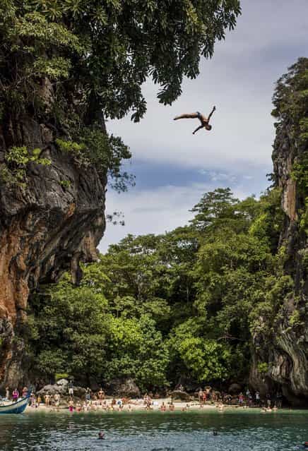 In this handout image provided by Red Bull, Gary Hunt of the UK dives from the 27 metre platform on Hong Island in the Andaman Sea during the last competition day of the eighth and final stop of the 2013 Red Bull Cliff Diving World Series on October 26, 2013 at Krabi, Thailand. (Photo by Romina Amato/Red Bull via Getty Images)