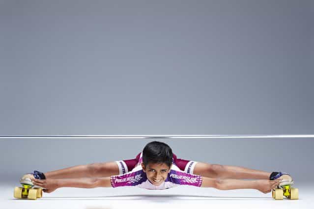Rohan Kokane, from India who has made it into the Guinness Book of World Records for for being the lowest limbo skater, achieving a roller-skating height of just 25 cm over a distance of 10 meters. (Photo by PA Wire)