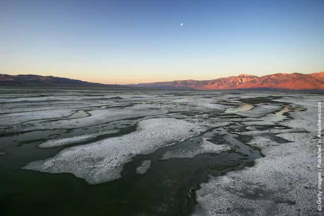 Large shallow pools of restored water cover portions the salty crust of mostly-dry Owens Lake