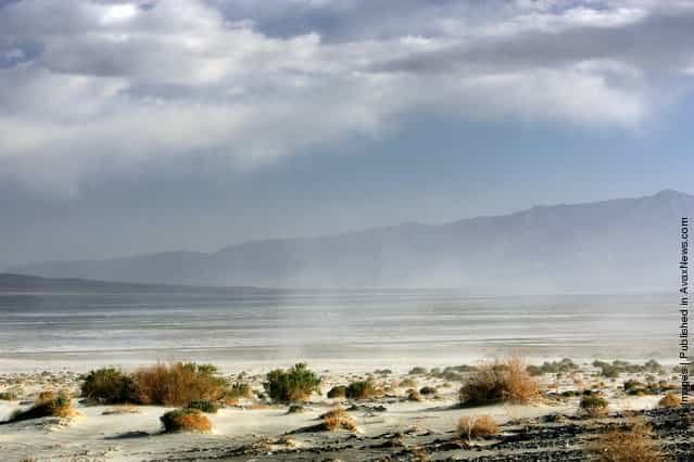 High winds blow sand across the highway near the original north shore of Owens Lake