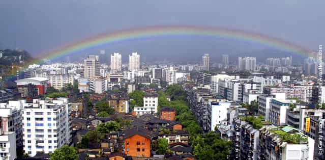 A rainbow appears in the sky after rainstorms following the landing of typhoon Haitang