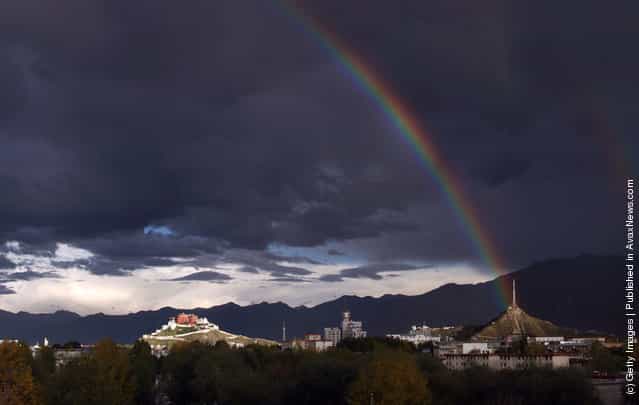 A rainbow appears on the sky over the Potala Palace in Lhasa
