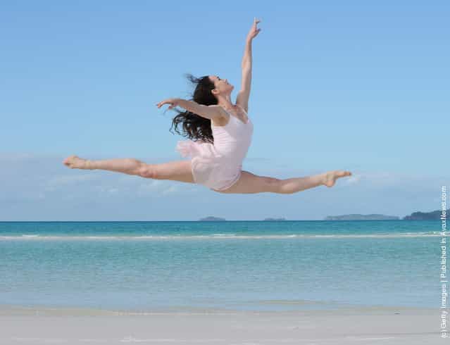 Australian ballet dancers rehearse their moves on Whitehaven Beach on Hamilton Island, Australia