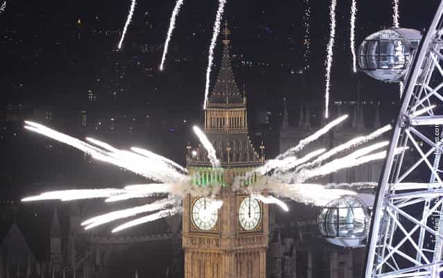 Fireworks light up the London skyline and Big Ben just after midnight on January 1, 2012 in London, England