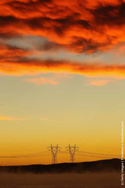 A view of power lines in early morning fog from the Hazelwood Power Station cooling pondage in Melbourne, Australia