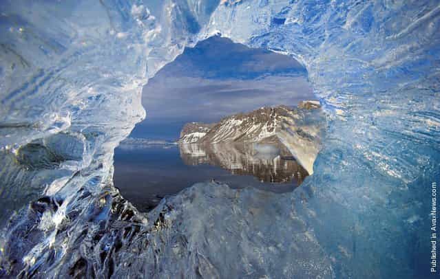 The hole in the ice of the glacier Hornsund, The archipelago of Svalbard