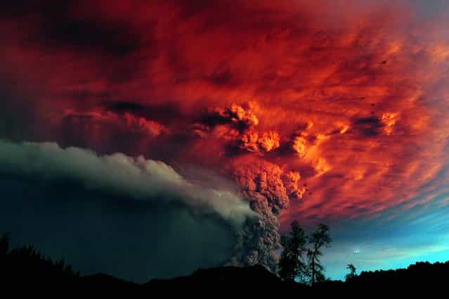 A cloud of ash pours from Puyehue volcano in southern Chile, at sunset on June 5, 2011