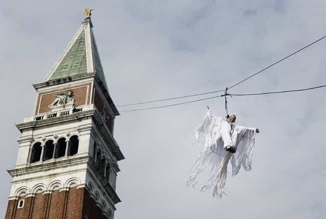 Italian athlete Federica Pellegrini descends the St.Mark's bell tower during the flight of the angel, as a traditional opening ceremony for the beginning of the Carnival, on February 11, 2007 in Venice, Italy. (Photo by Marco Di Lauro)