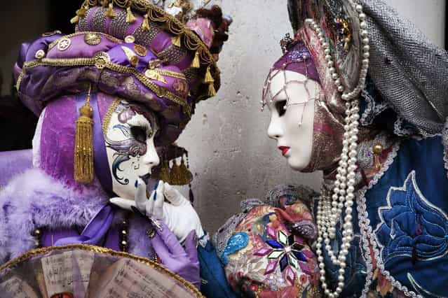 Masked participants stand in St.Mark's Square during the Carnival on February 10, 2007 in Venice, Italy. (Photo by Marco Di Lauro)