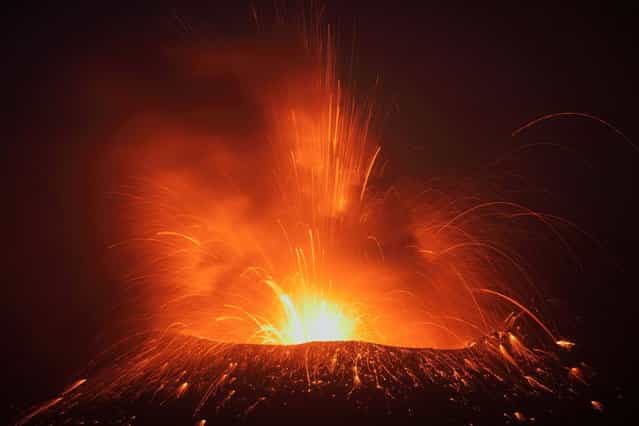 The dangers of getting up close to Earth’s greatest fiery spectacles don’t phase Rietze, who likens his profession to an extreme sport. [I have had fewer mishaps chasing eruptions than when mountain climbing]. (Photo by Martin Rietze/Guzelian)