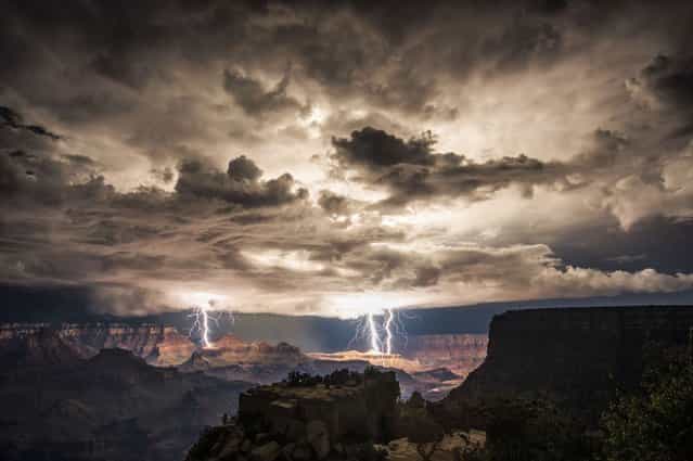 Using clever low exposure techinques, photographer Rolf Maeder managed to capture multiple strikes hitting the canyon under atmospheric stormy skies. (Photo by Rolf Maeder)