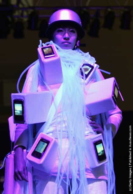 South Korean models, with wearable computers, walk the cat walk during the Ubiquitous Fashionable Computer Fashion Show