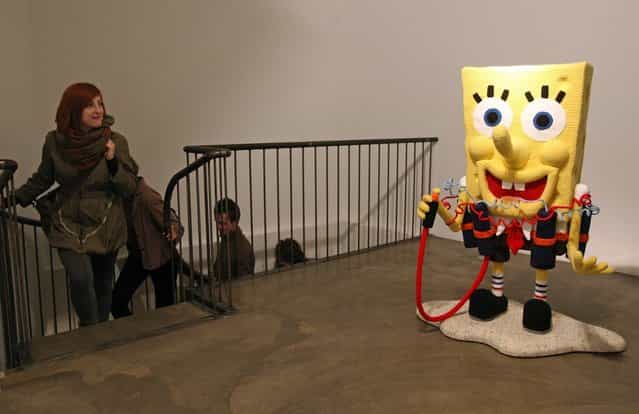 The knitted sculpture Spongebob by Patricia Waller, featuring the cartoon character as a suicide bomber, stands in the Broken Heroes exhibition at the Deschler Gallery