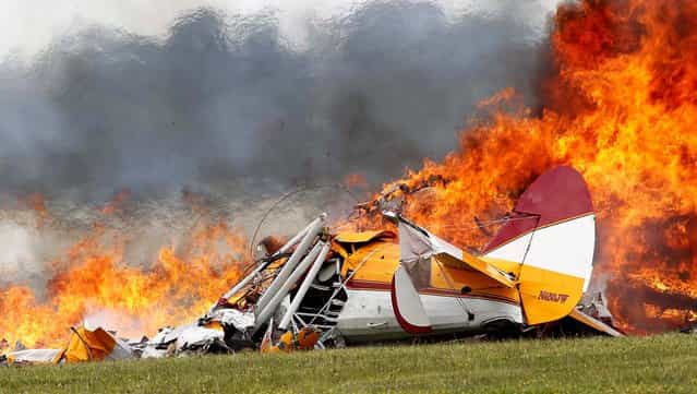 The plane burns after impact. (Photo by Ty Greenlees/Dayton Daily News)