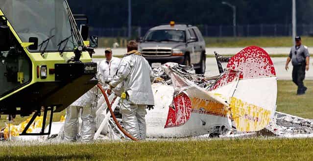 Firefighters and emergency workers work the scene of the crash. (Photo by Ty Greenlees/Dayton Daily News)