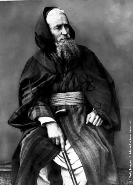 circa 1890: A middle-class Jew from Tangiers in traditional cloak and cummerbund