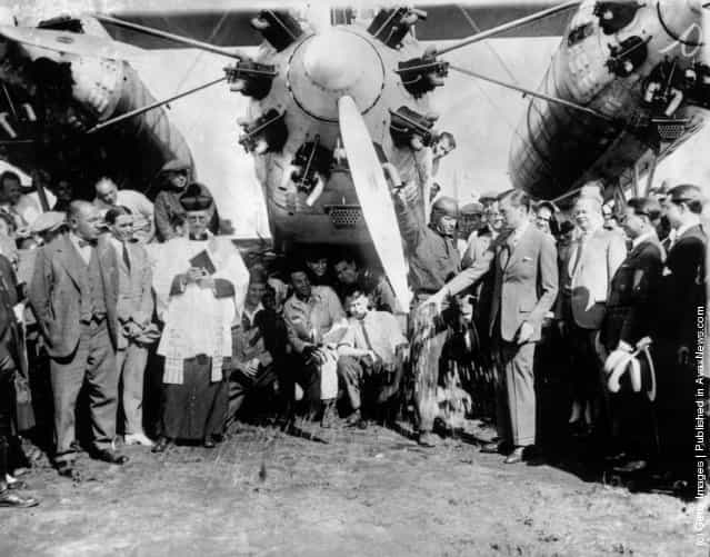 The Mayor of New York, James J. Walker, christens Captain Rene Fonck's mammoth Sikorsky at Roosevelt Field, New York