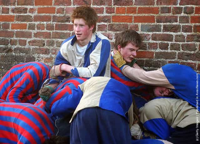  The youngest son of the Prince of Wales, Prince Harry and his brother Prince William (far right) take part in the Wall Game between Dr Gaileys Old Boys and the Mixed Wall in March, 2003 at Eton College, Eton