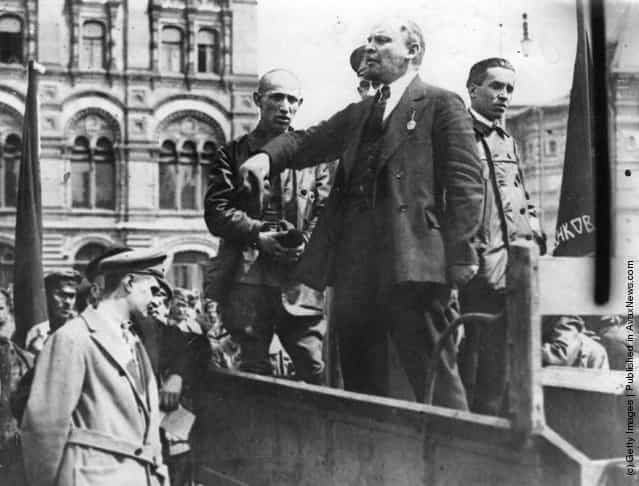 Vladimir Ilyich Lenin, Russian dictator, gives a speech from the back of a vehicle in a Russian street