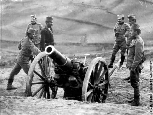 1915: Serbian officers with a Howitzer battery as they prepare to fire on Austrians, during the First World War