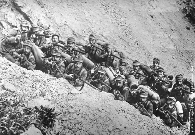 1915: Italian soldiers in a trench on a mountain side, ready for action