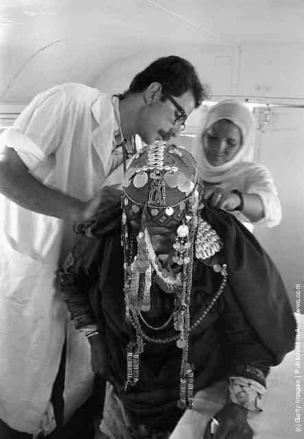 1969: Israeli physician Dr. Avraham Hamavi is asssited by Bedouin nurse Amana Abu Halil nurse as he examines a Bedouin woman in a mobile clinic some two years after the Six-Day War on June 10, 1969, near Rafah, Gaza Strip. Thirty-eight years after Israel captured the Gaza Strip from the Egyptians during the campaign, the Jewish state looks poised to leave the populous Palestinian territory as Prime Minister Ariel Sharon's disengagement plan approaches its August 15, 2005 implementation