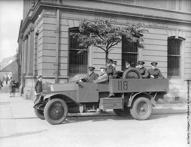 1935: A Royal Ulster Constabulary armoured car patrolling near York Street in Belfast following riots after an Orange Order parade