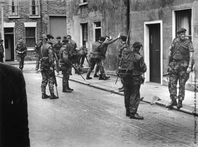 1971: British troops searching a civilian in Belfast