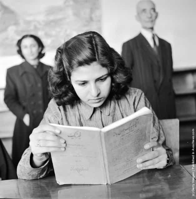 1952: A girl student at a vocational training school for seamstresses studies the theoretical aspects of her work. This is one of the first schools for girls founded by the government in Teheran