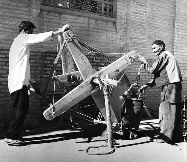 1955: A well is dug in Yazd, Iran, using a wooden windlass and leather bag. Many of the methods and construction techniques used in Iran have not changed in a thousand years