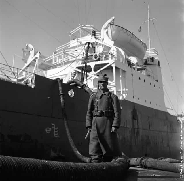1955: A Persian soldier guarding an oil production site belonging to the Iranian oil company at Abadan on the northern tip of the Persian Gulf