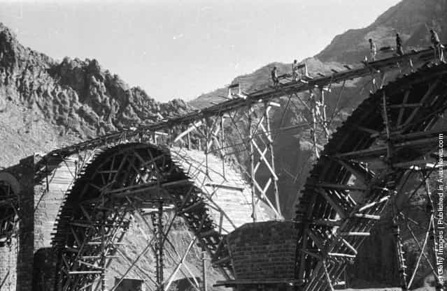1956: A railway bridge spanning a ravine uner construction to form part fo the Trans-Iranian railway