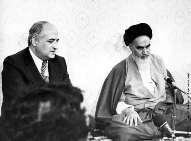 1979: The new ruler of Iran Ayatollah Khomeini listens to the visiting Foreign Minister of Turkey Gunduz Okcun during a meeting at his residnce at Kum, Iran