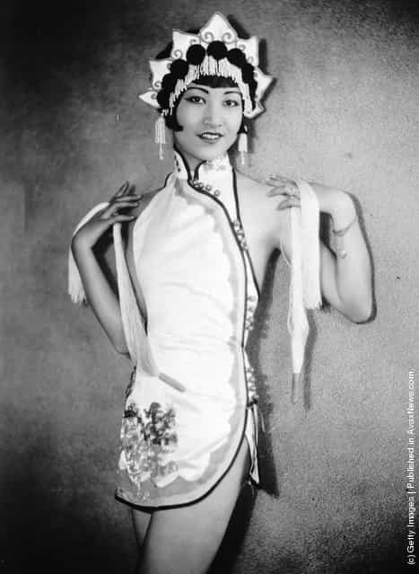 1935: American-Chinese actress Anna May Wong (1907 - 1961) wearing an Oriental-style costume and headdress