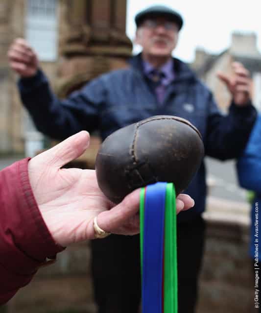 The leather ball is held before the start of the annual Fastern Eve Handba event in Jedburghs High Street in the Scottish Borders in Jedburgh, Scotland