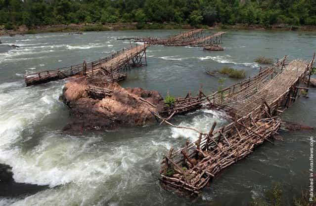 People of the Mekong have invented all manner of ingenious ways of catching fish, many of them adapted to a specific site, flow and time of year. These lee traps at the Khone Falls in southern Laos, captured on June 2, 2010, are an excellent example: fishermen construct the traps in the dry season when water levels are low to catch fish at the onset of the rainy season. As the rising water levels cue the fish to begin their migration, the traps are inundated and literally strain the migrating fish out of the water column