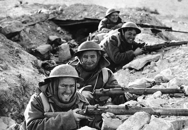 British Infantrymen in position in a shallow trench near Bardia, a Libyan Port, which had been occupied by Italian forces, and fell to the Allies on January 5, 1941, after a 20-day siege
