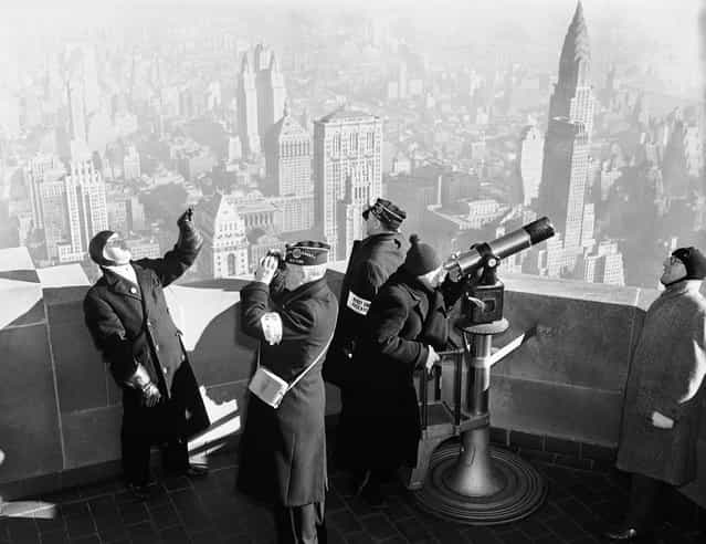A crew of observers on the Empire State building, during an air defense test, on January 21, 1941 in New York City, conducted by the U.S. Army. Their job was to spot [invading enemy] bombers and send information to centers which order interceptor planes. The tests, to run for four days, covered an 18,000-square-mile area in northeastern states