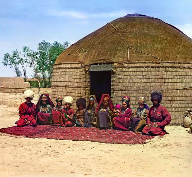 Photos by Sergey Prokudin-Gorsky. Tekin with his family (group of eleven adults and children, seated on a rug, in front of a yurt). Russia, Transcaspian Region, Merv uyezd (district), Bairam-Ali area, 1911