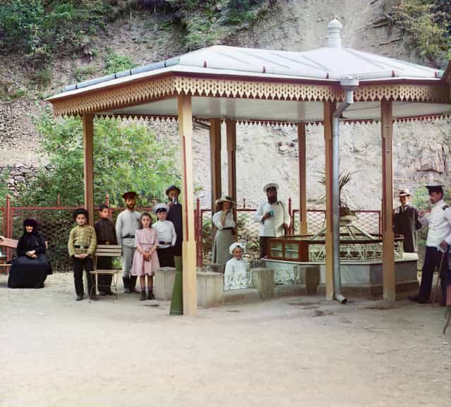 Photos by Sergey Prokudin-Gorsky. Evgeniev spring. Borzhom (Group of people standing near natural spring at a health resort; some are drinking the mineral water). Russia, Tiflis province, Gori district, Borjomi, 1912