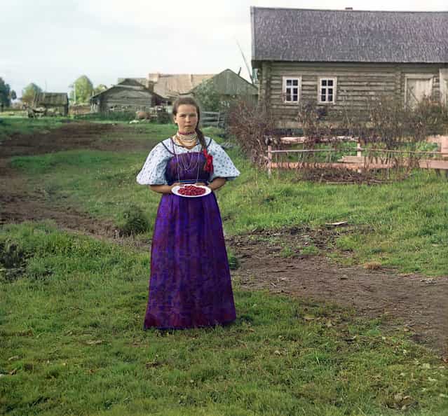 Photos by Sergey Prokudin-Gorsky. Girl with strawberries. Russia, Novgorod province, county Kirillov, 1909