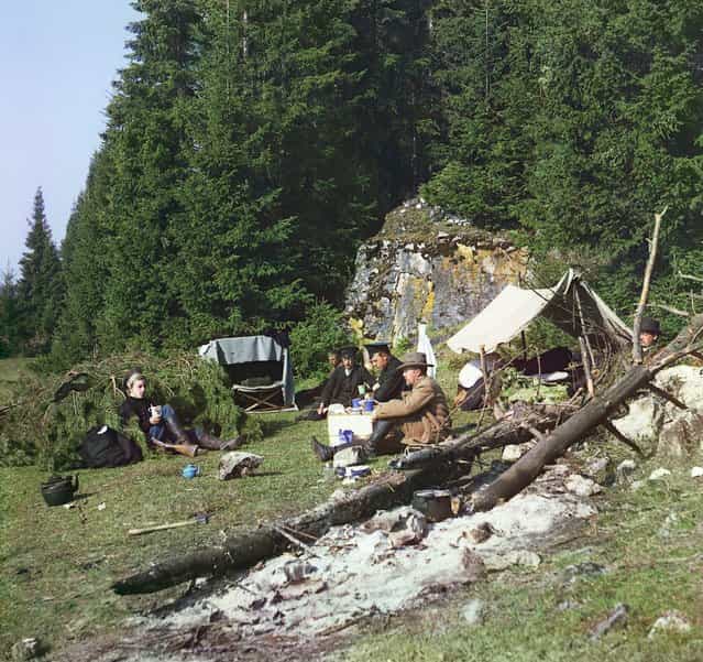 Photos by Sergey Prokudin-Gorsky. Night camp by a rock on the bank of the Chusovaia (Sergei Prokudin-Gorskii and others seated at a campsite). Russia, Perm Province, Kungur uyezd (district), Demidova Utka village area, 1912