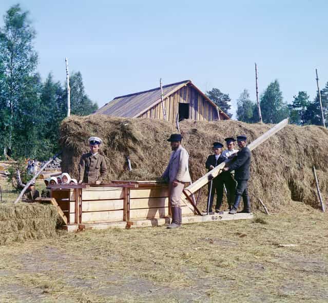 Photos by Sergey Prokudin-Gorsky. Baling machine for hay. Russia, Olonets province, Petrozavodsk uyezd (district), Kivach station, 1916