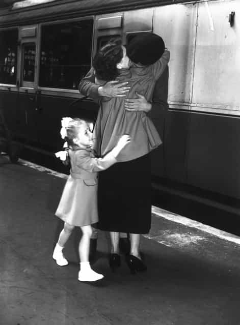 National Serviceman Tony Kemp of Bermondsey is greeted by his fiancee, on his return from Korea, at Waterloo, London, 1952. (Photo by Terry Fincher)