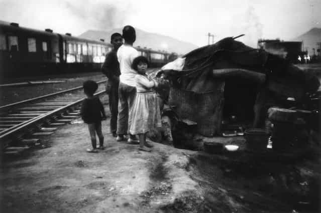 Refugees in post-war Korea who have put up their makeshift home near a railway, 16th July 1955 (Photo by John Chillingworth)