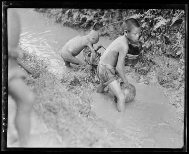 Boys Fishing. China, Xindu Xian, 1917-1919. (Photo by Sidney David Gamble)