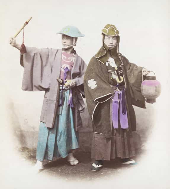 Two Japanese samurai in fire dress, circa 1865. The one on the left wears a jingasa hat, and the one on the right wears the traditional indigo tabi socks of the samurai firefighter. (Photo by Felice Beato)