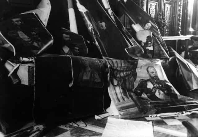 Portraits of the Tsars of Russia, Alexander III, right, Alexander II, above centre, and Nicholas II, left, which were torn from the walls during the Russian Revolution, 1917. (Photo by Three Lions)